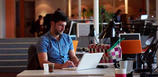 Video Game Designed Working at Desk