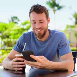 Guy Playing Mobile Video Game during his Work Break